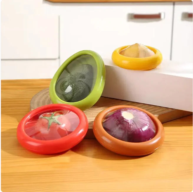 Multicolored set of small round plastic or rubber storage containers, each just big enough to stretch over a wedge of onion, or lemon, etc to keep them fresh.see through to tell what is inside