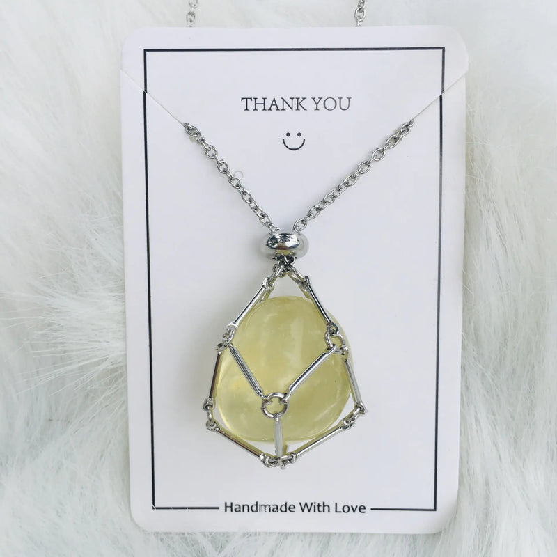 Crystal Pendant Necklace with the crystal suspended from it's chain in a open metal sling. It is attached to a white card that says Thank You at the top and Handmade With Love at the bottom.