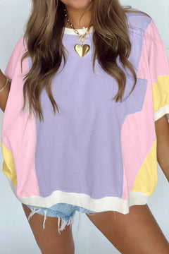 Color Block Patchwork Half Sleeve Oversized T Shirt with dropped shoulder and cuffed sleeves and banded hem at the bottom of the shirt. main block of color is pastel purple with verticle blocks of pink on each side and furthest out on each side are vertical blocks of yellow. The sleeve cuffs, and hem at neck and bottom are white. Purple pocket over the heart straddles the purple and pink block.