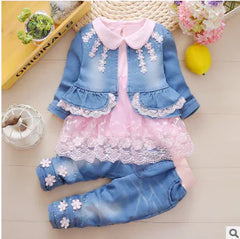 Girls 1-3 year denim and lace outfit with blue jeans and matching jean jacket to be worn over a lace tunic, trimmed in lace and daisies on the pants cuffs, pink elastic waist