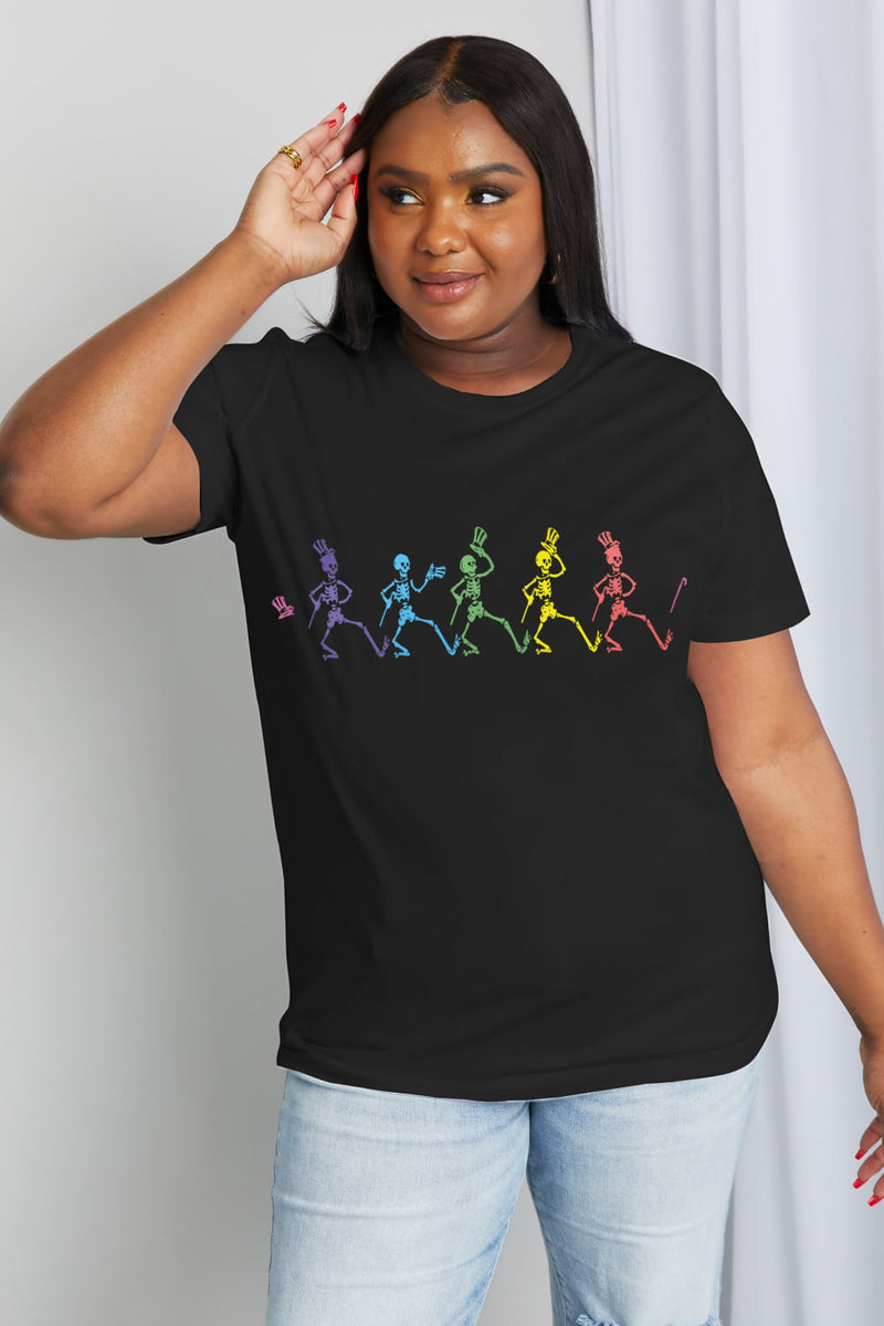 Black short sleeved tshirt with colorful dancing skeletons with top hats and canes all in a row on the front.