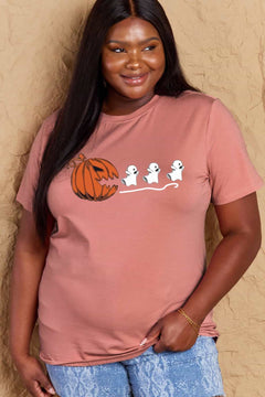Pink Tshirt with Jackolantern appearing to be trying to eat a line of fleeing ghosts