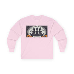 Pink Tee shirt with a Halloween-themed graphic,witches standing with brooms facing the full moon slogan says Lets get Wicked at the bottom and Girls Trip at top