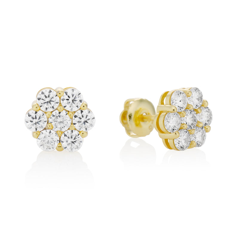 Gold and moissanite earrings on a white background