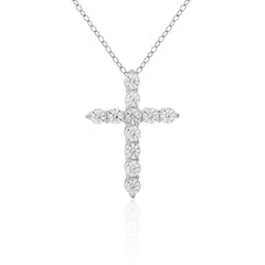 Diamond cross necklace on a white background