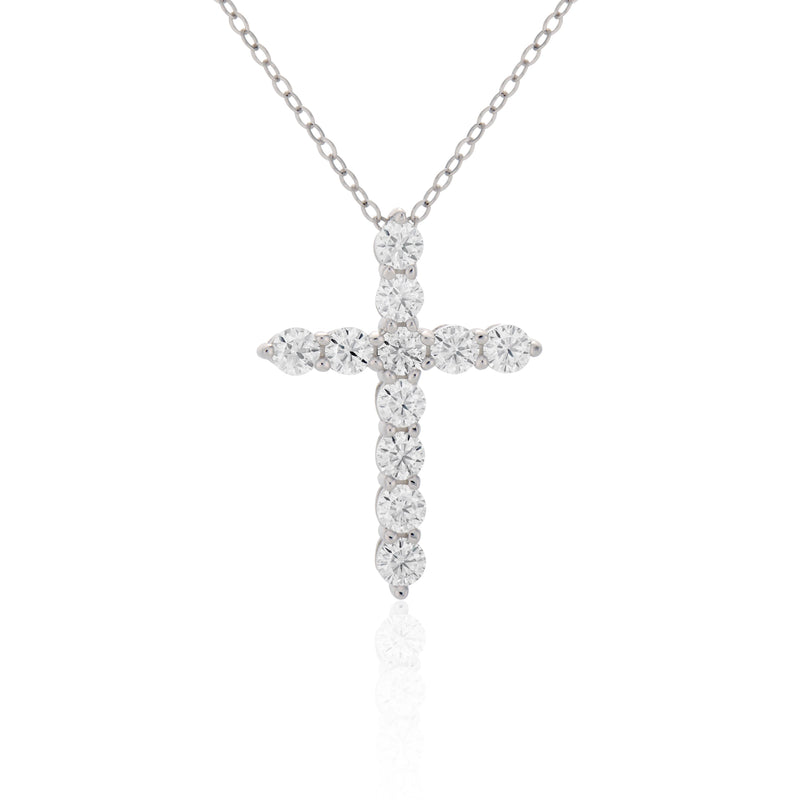 Diamond cross necklace on a white background