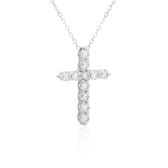 Diamond cross necklace on a white background