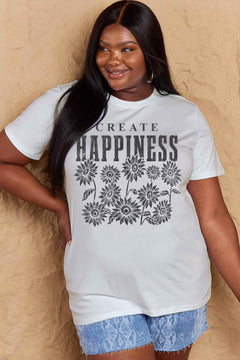 White Tshirt with round neck and short sleeves, the caption in capital letters says CREATE HAPPINESS, with create being in small letters centered over Happiness. underneath the letters, in white as well, ten flowers arranged in three rows.