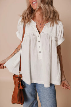 White cotton Textured Short Sleeve  Frayed Blouse. Collarless with five buttons down the front and made to hang full and loose