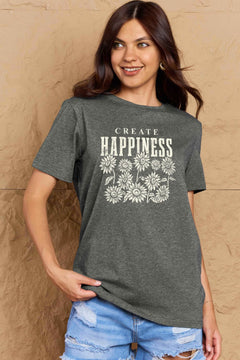 Grey Tshirt with round neck and short sleeves, the caption in capital letters says CREATE HAPPINESS, with create being in small letters centered over Happiness. underneath the letters, in white as well, ten flowers arranged in three rows.