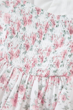 Floral top with pink and green pattern on a white background