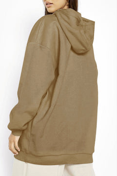 Brown hoodie worn by a person on a white background