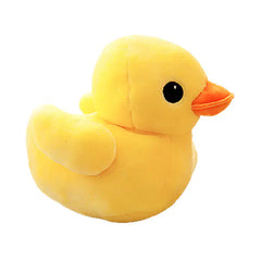 Yellow plush duck toy on a white background
