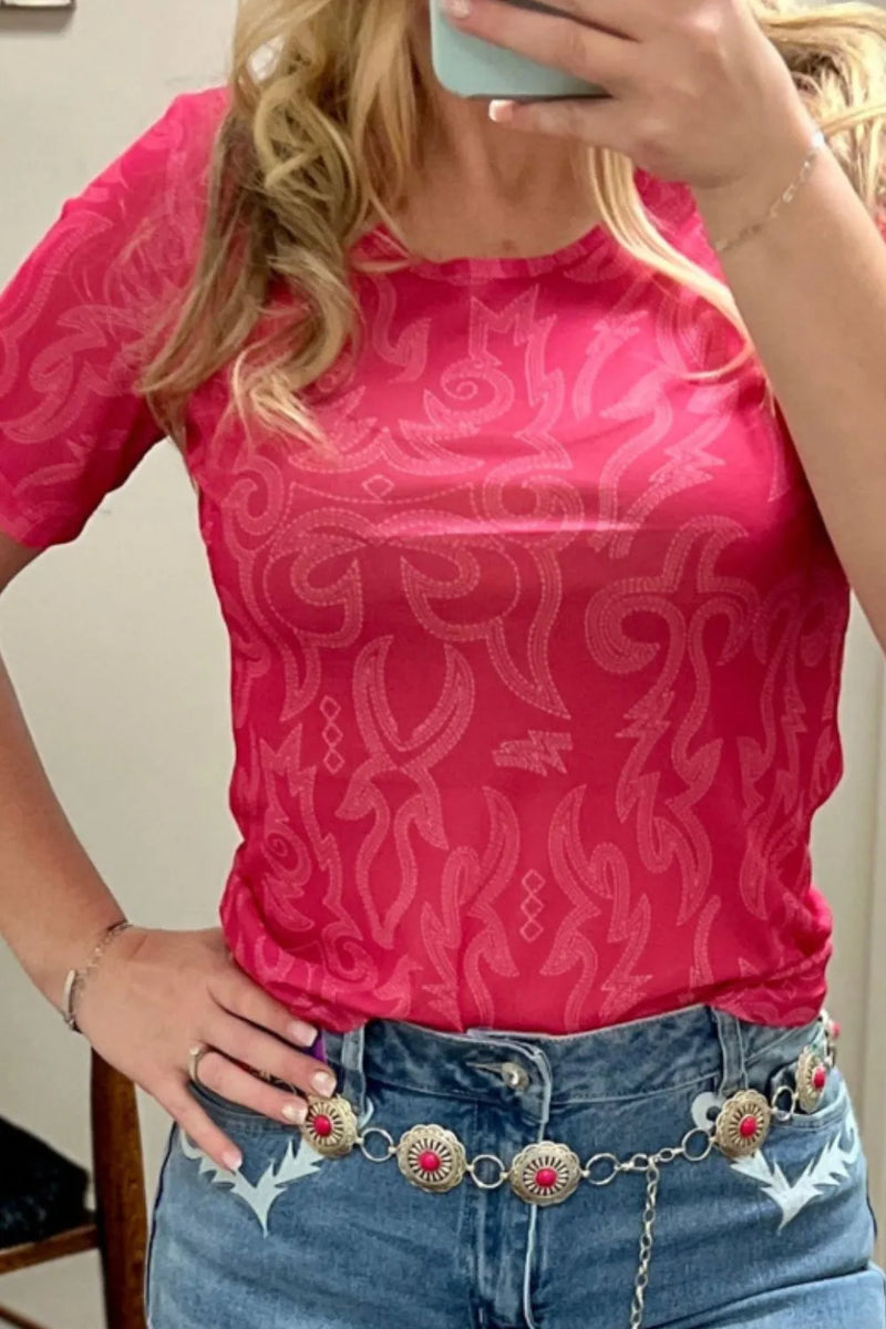 Strawberry red form fitting tshirt with round neck and short sleeves, abstract pattern all over the shirt in lighter shade