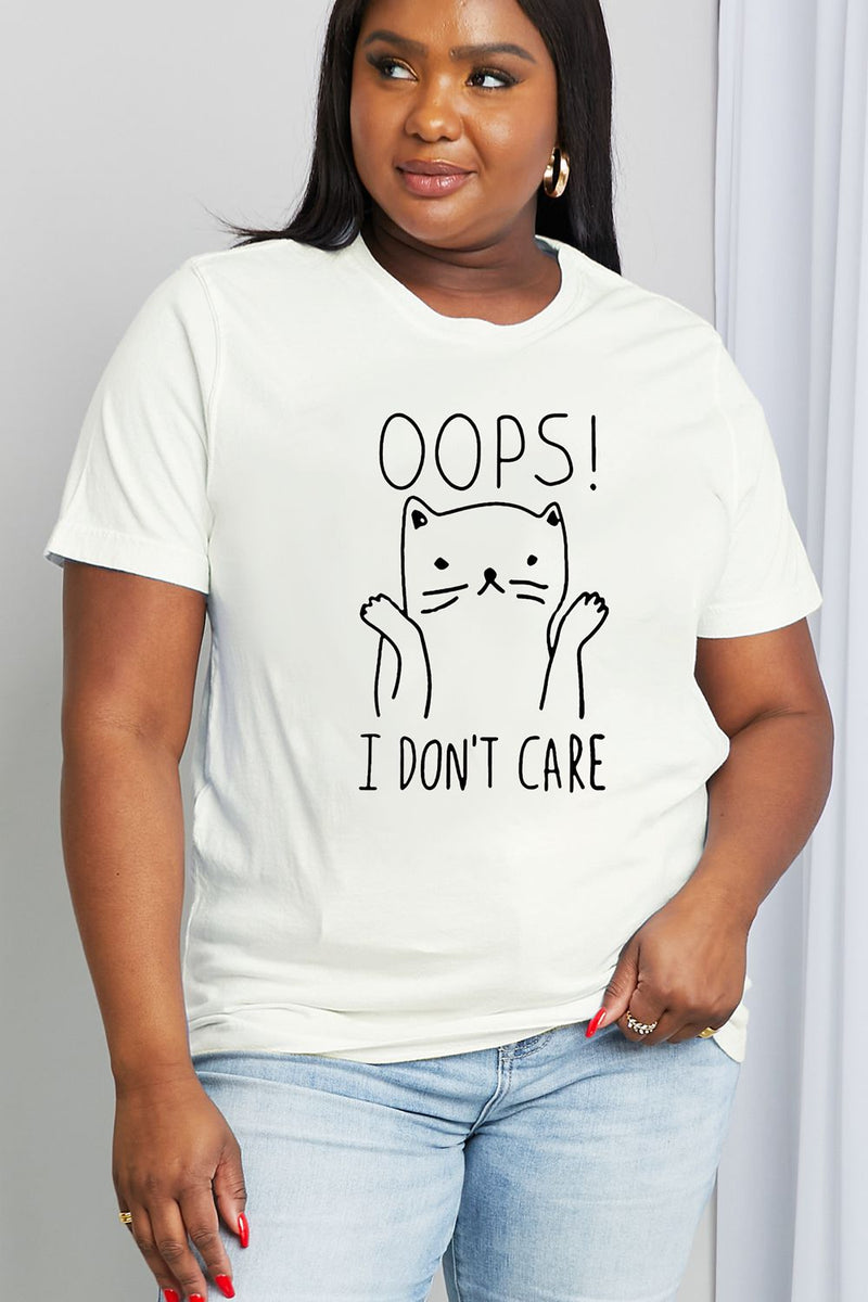 White short sleeved cotton Tshirt with Black lined drawing of cartoon cat throwing up it's paws in a 'whatever' attitude and the caption reads: OOPS I DON’T CARE