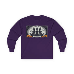 Purple Tee shirt with a Halloween-themed graphic,witches standing with brooms facing the full moon slogan says Lets get Wicked at the bottom and Girls Trip at top