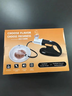 Box of a handheld smoke infuser with branding and product features on an orange background.