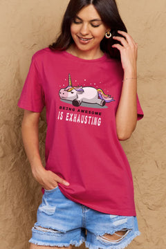 Dark Pink Tshirt with a unicorn laying on it's belly with all legs splayed out and the slogan BEING AWESOME IS EXHAUSTING under it. Round neck and short sleeves