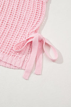 Pink textured beach cover up with a bow tied on the hip area