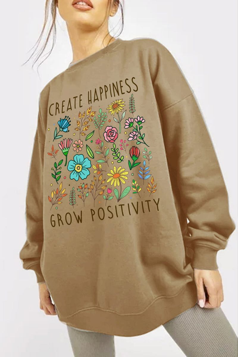 Brown sweatshirt with floral design and text says CREATE HAPPINESS GROW POSITIVITY