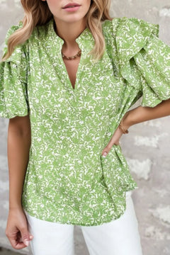 Dressy collarless shirt with ruffled sleeves and green and white floral print