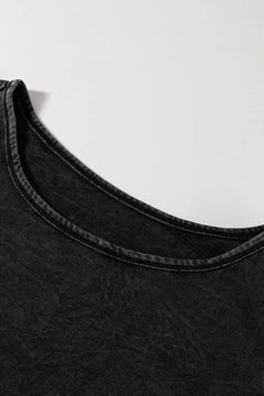 Close-up of a black sleeveless top on a white background