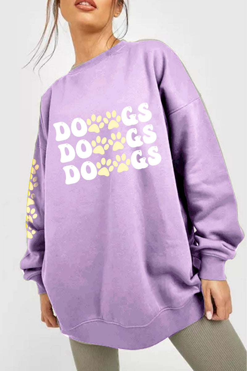 A purple sweatshirt with 'DOGS DOGS DOGS' text with pawprints between the Os and the Gs, and down the right arm