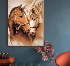 Painting of two horses on a wall with a couch and decorative elements below.