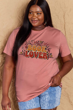 A pink t-shirt with 'Book Lover' printed in front of s mass of small flowers and stems