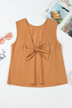 modest round neck front sleeveless tank has plunging V  neck in back with bow of same fabric in center of back