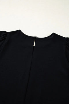Black dress with a zipper detail on a white background