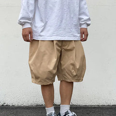 Beige Men's hip hop shorts with drawstring on a white background