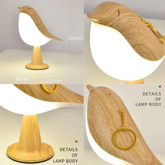 Wooden bird-shaped lamp with measurements and keychain attachment on a light background