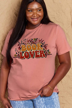 A pink t-shirt with 'Book Lover' printed in front of s mass of small flowers and stems