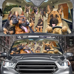 Car sunshade with a design of a German Shepherd driving a car, shown on a car and in a cityscape.
