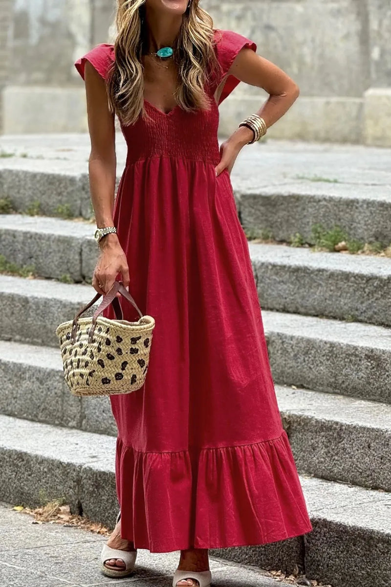 Smocked Tiered Cap Sleeve Maxi Dress in Scarlet red with V neck and wide ruffled skirt hem.