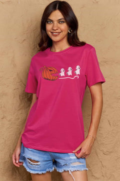 Pink Tshirt with Jackolantern appearing to be trying to eat a line of fleeing ghosts