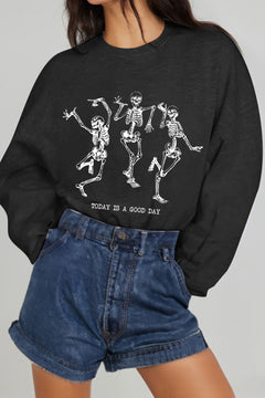Black long sleeved sweatshirt with three dancing skeletons on the front with TODAY IS A GOOD DAY printed below.