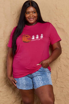 Pink Tshirt with Jackolantern appearing to be trying to eat a line of fleeing ghosts