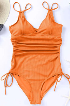 Orange swimsuit with tie details on a white background