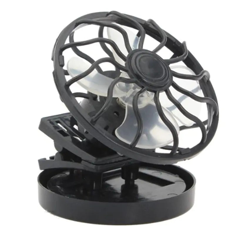 Black portable fan with transparent cage on a white background has clip to mount