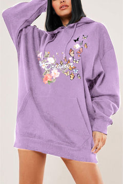 Purple hoodie with floral and butterfly design with Dreamer in Cursive white letters across the front. Dropped shoulder pull over with hand warmer pocket