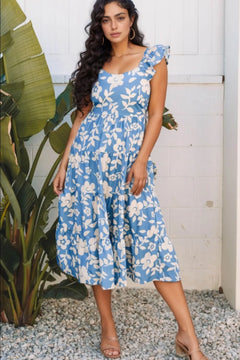 Beautiful sky blue dress with round scoop neck and ruffled short half sleeves with white floral pattern all over it. Skirt comes below the knees and is full.
