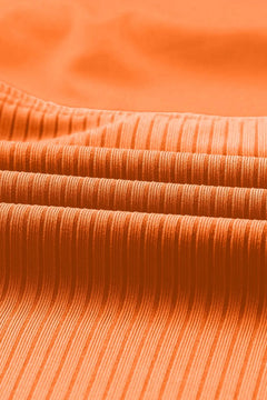 Close-up of orange ribbed fabric texture