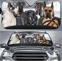 Car sunshades with images of dogs in various poses on a car interior and exterior.