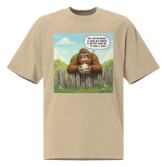 Beige t-shirt with a cartoon design of a Sasquatch holding an Easter egg, bubble declares, Yep, Easter Bunny is good, but nobody is better than me at Hide N Seek!