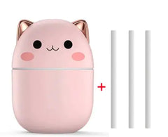 Pink cat-shaped USB device with a plus sign and two white sticks on a white background
