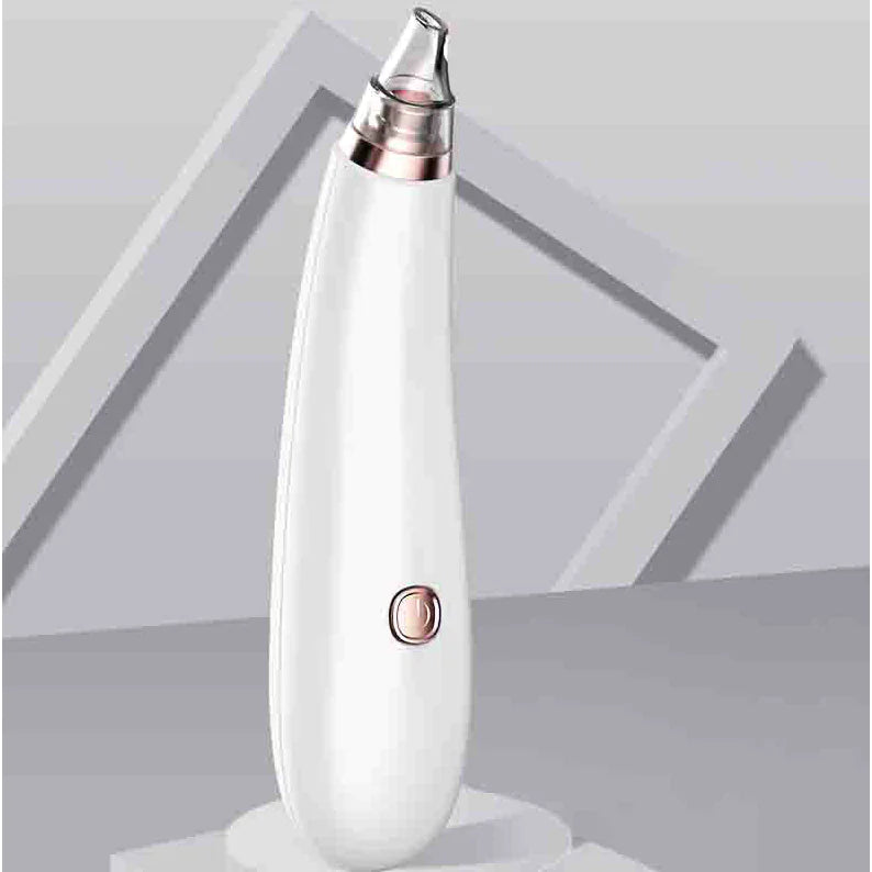 White electronic blackhead remover with rose gold accents on a light gray background