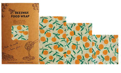 Set of beeswax food wraps with orange design on a white background