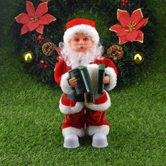 Santa Claus figurine holding an accordion on a grassy background with decorative flowers and ornaments.